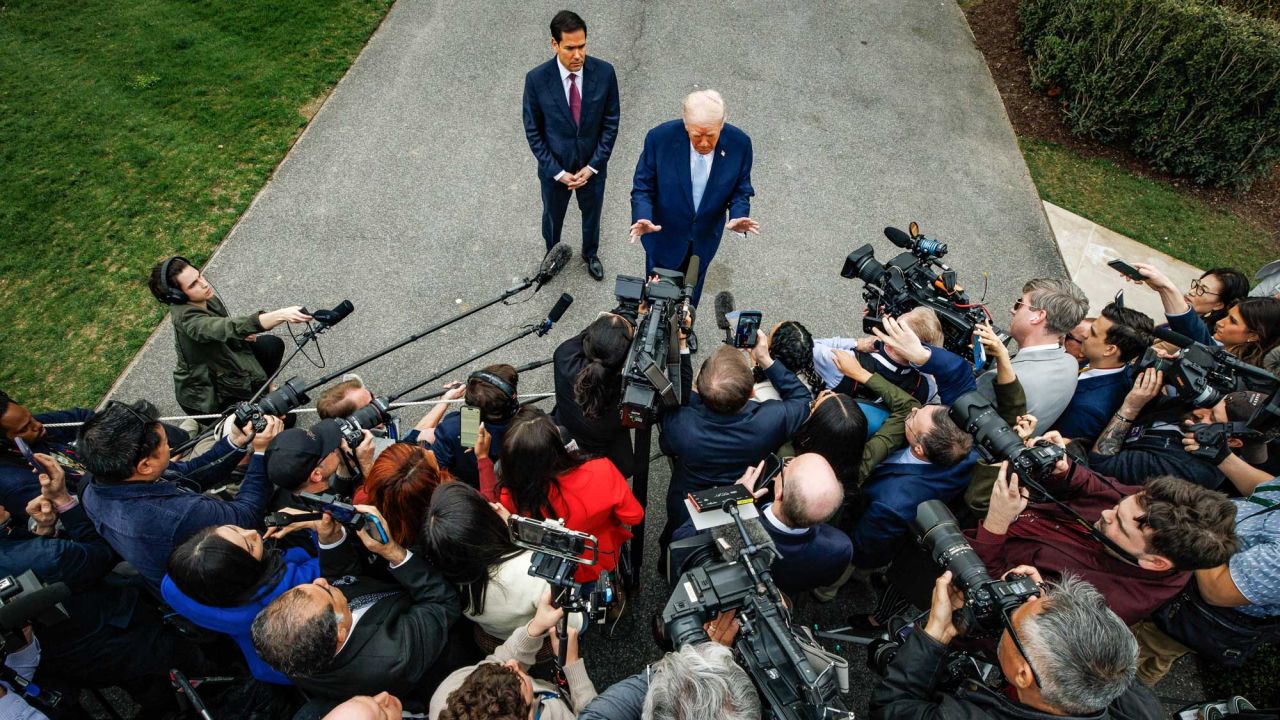 U.S. President Donald Trump speaks to reporters with U.S. Secretary of State Marco Rubio before departing from the South Lawn of the White House in Marine One on March 20, 2026 in Washington, D.C. Trump is heading to Palm Beach, Florida, where he will be spending the weekend at his private club, Mar-a-Lago. (Photo by Samuel Corum/Sipa USA)