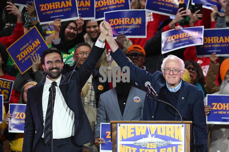 Mayoral Candidate Zohran Mamdani (l) and Bernie Sanders (r) stand on stage together at an election rally for Mayoral Candidate Zohran Mamdani at Forest Hills Stadium in the Queens borough of New York City, NY, October 26, 2025. (Photo by Anthony Behar/Sipa USA)