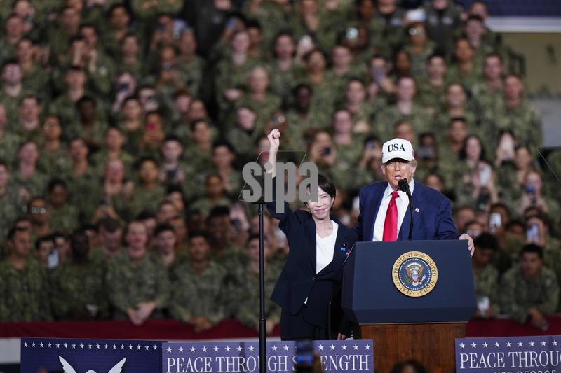 U.S. President Donald Trump (R) speaks to military personnel as Japanese Prime Minister Sanae Takaichi gestures aboard the aircraft carrier George Washington at the U.S. Navy base in Yokosuka, Kanagawa Prefecture, eastern Japan, on Oct. 28, 2025. (Photo by Kyodo News/Sipa USA)
