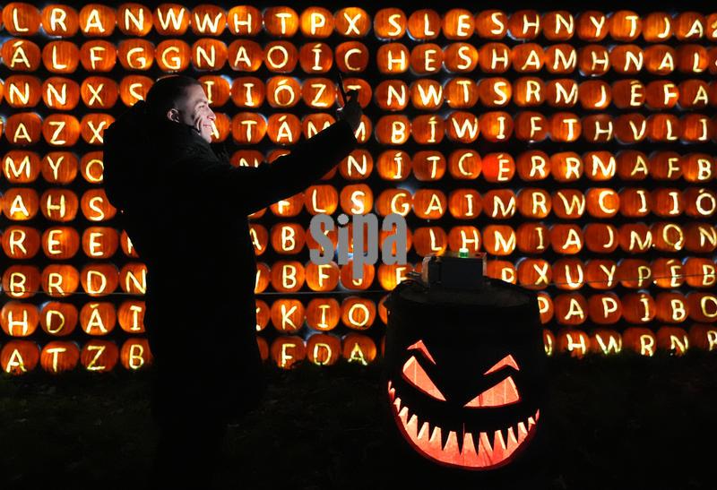 10/29/2025 - Roy Mendoza from Mexico takes a selfie at , Pumpkins After Dark at Newbridge House, Donabate, Dublin, throughout October evenings. The outdoor festival features thousands of hand-carved pumpkins in illuminated displays, live carving demonstrations, and seasonal food and drinks. A family-friendly event, it offers a magical after-dark Halloween experience for visitors of all ages. Picture date: Wednesday October 29, 2025. (Photo by Niall Carson/PA Images/Alamy Images/Sipa USA) *** US Rights Only ***