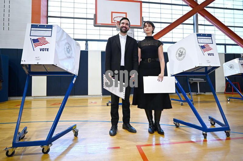 New York City mayoral candidate Zohran Mamdani (l) and his wife Rama Sawaf Duwaji (r) vote on Election Day, in New York City borough of Queens, NY, November 4, 2025. (Photo by Anthony Behar/Sipa USA)