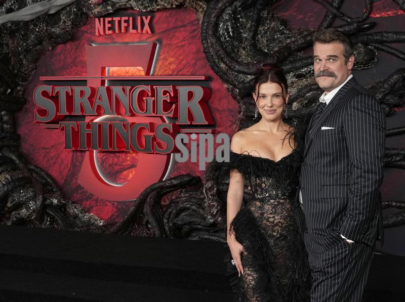 (L-R) Millie Bobby Brown and David Harbour at the Netflix's STRANGER THINGS Season 5 World Premiere held at the TCL Chinese Theatre in Hollywood, CA on Thursday, ​November 6, 2025. (Photo By Sthanlee B. Mirador/Sipa USA)