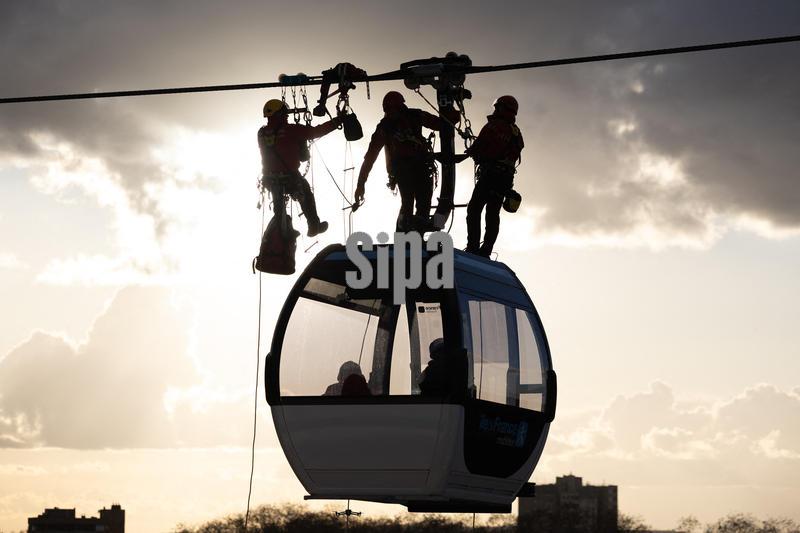 Firefighters take part in an evacuation drill for injured passengers in a cabin of the Paris region first urban cable car, the C1, in Limeil-Brevannes, a suburb of Paris, on November 20, 2025. Photo by Raphael Lafargue/Abaca/Sipa USA