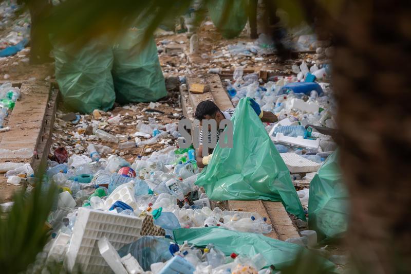 Clenaning the beach after strong wind 