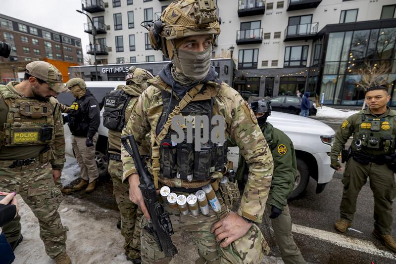 MINNEAPOLIS, MINNESOTA - JANUARY 0​8: A border patrol agent patrols the street in Minneapolis, Minnesota, on January, 8, 2026.  An Immigration and Customs Enforcement officer fatally shot a woman during a confrontation in Minneapolis, sparking an uproar over the presence of ICE agents in the city and heightening political divisions around the Trump administration's migrant crackdown. (Photo by Michael Nigro/Sipa USA)