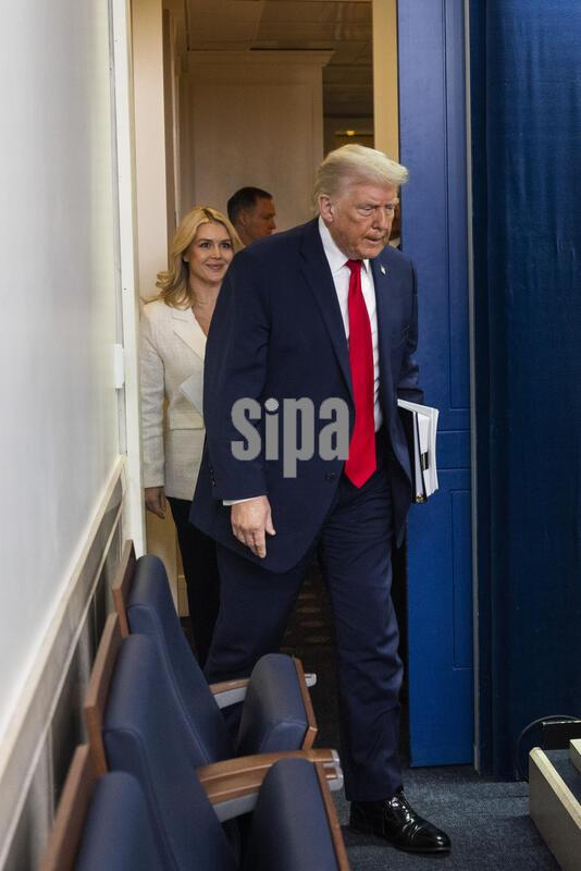 US President Trump speaks on to reporters ahead of trip to Davos