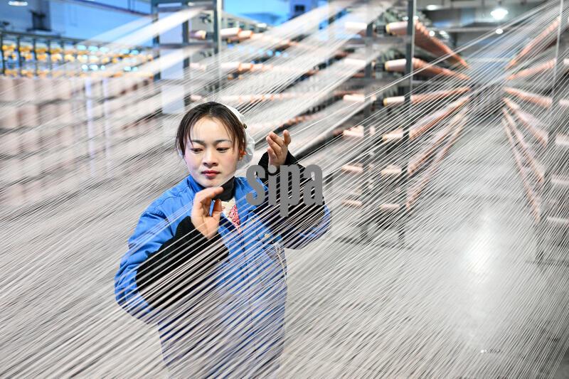 SUQIAN, CHINA - JANUARY 22, 2026 - A worker is producing products in the spinning workshop of a chemical fiber company in Suqian City, Jiangsu Province, China on January 22, 2026. (Photo by CFOTO/Sipa USA)