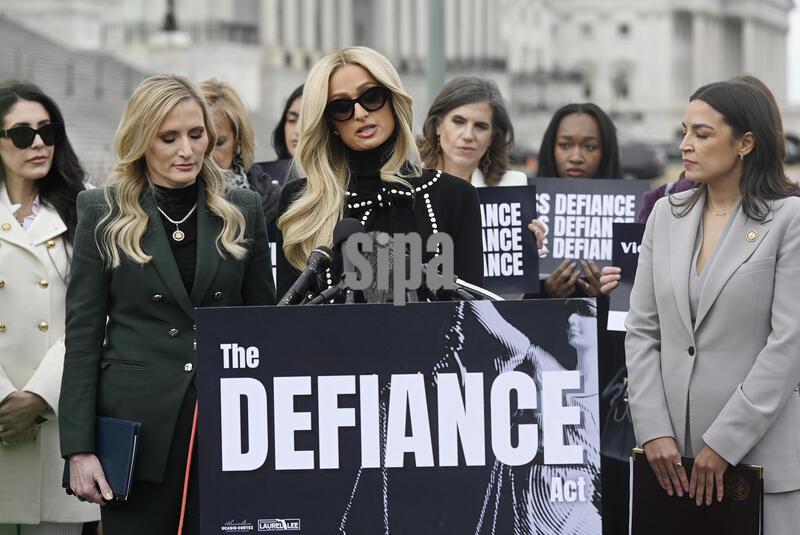 Paris Hilton (C) alongside Rep. Alexandria Ocasio-Cortez (R) (D-NY) and Rep. Laurel Lee (R) (R-FL) , speaks during a bipartisan press conference in support of the Defiance Act at the U.S. Capitol on January 22, 2026 in Washington, DC. The Defiance Act proposes that legal recourse be provided for victims of nonconsensual deepfake pornography. Photo by Olivier Douliery/Abaca/Sipa USA