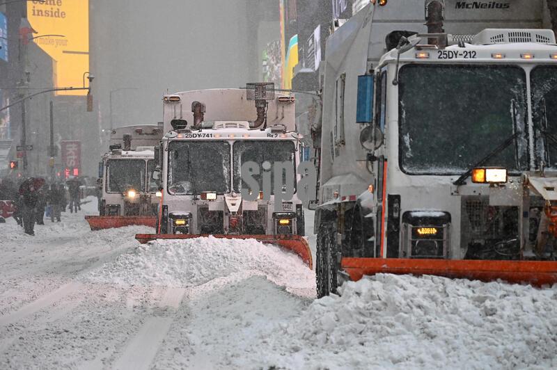 New York City Sanitation Dept. trucks plow the roads in Times Square during a winter storm, New York, NY, January 25, 2026. New York City and it's five boroughs are expecting six to eight inches of snow accompanied by very cold temperatures as a winter weather advisory has put out for the area; a massive winter storm blankets the US East Coast after dropping ice and snow across much of the United States, and leaving many with power. (Photo by Anthony Behar/Sipa USA)