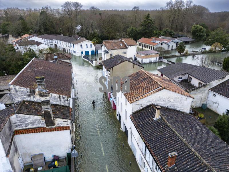 Gond Pontouvre (16): aerial view of the Charente river flooding in this small town on the outskirts of Angoulême following heavy winter rainfall and torrential rain in the south-west as Storm Pedro passed through. A lone man walks down the main street, which has been partially evacuated of its inhabitants - Photo by Duffour P/ANDBZ/Abaca/Sipa USA
