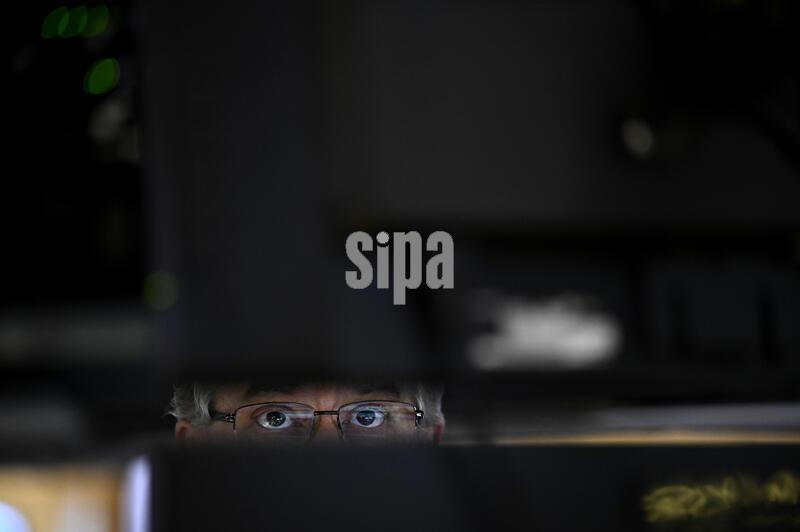 A sales trader looks at his monitors inside the New York Stock Exchange shortly before the closing bell, New York, NY, March 26, 2026. Stock prices fell sharply while oil prices rose with the Dow Jones Industial Average dropped 1%; Nasdaq sank 10% below its record. (Photo by Anthony Behar/Sipa USA)