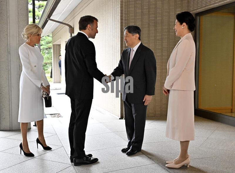 Japanese Emperor Naruhito (2nd from R) and Empress Masako (far R) greet French President Emmanuel Macron and his wife, Brigitte Macron, at the Imperial Palace in Tokyo on April 2, 2026. (Pool photo) (Photo by Kyodo News/Sipa USA)
