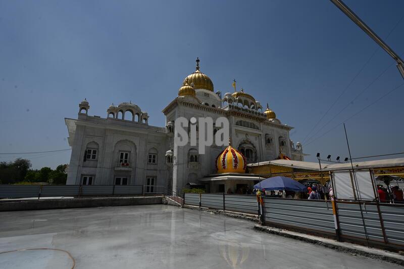 India: Devotees Take Holy Bath In Sarovar Of Gurdwara Bangla Sahib On The Baisakhi Festival