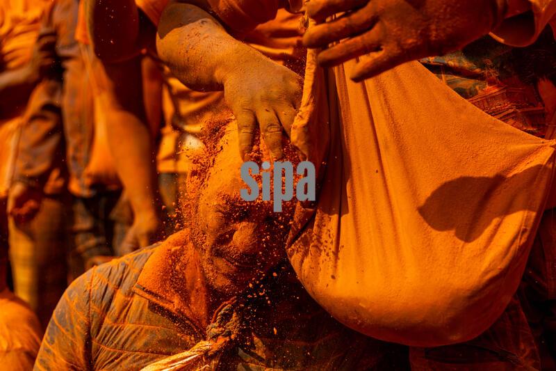 (260415) -- BHAKTAPUR, April 15, 2026 (Xinhua) -- A man is smeared with vermilion powder during a celebration of the Sindoor Jatra festival in Bhaktapur, Nepal, April 15, 2026. The festival is celebrated to welcome the Nepalese New Year and the beginning of spring in Nepal. (Photo by Sulav Shrestha/Xinhua) (Photo by Xinhua/Sipa USA)