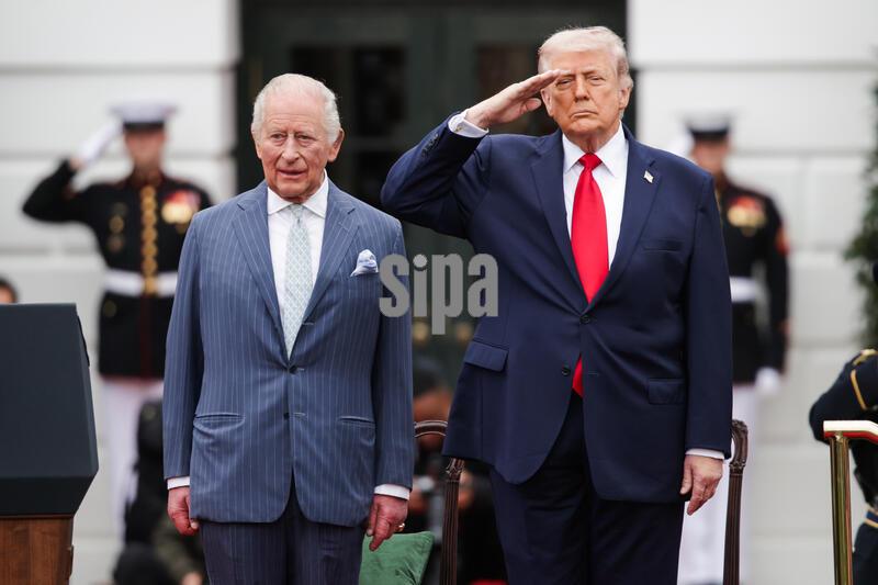 King Charles III of the United Kingdom stand with U.S. President Donald Trump as he salutes during a Pass and Review by members of the U.S. Armed Forces during a State Arrival Ceremony at the White House on April 28, 2026 in Washington, D.C. This is the first official visit to the United States for King Charles since rising to the throne where he’ll be visiting the nations capitol, New York, and Virginia as well as speaking before a joint session of U.S. Congress later this afternoon. (Photo by Samuel Corum/ Sipa USA)