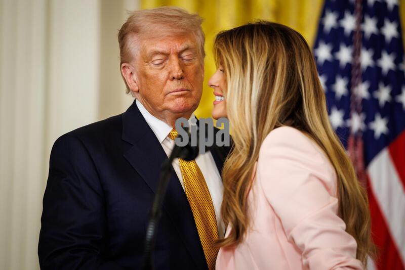 President Donald Trump and First Lady Melania Trump attend an event honoring mothers and wives of American military in the East Room of the White House on May 6, 2026 in Washington, D.C. (Photo by Samuel Corum/ Sipa USA)