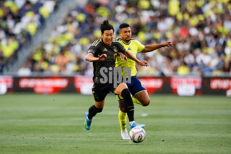 LAFC forward Son Heung-Min (7) and Nashville SC midfielder Bryan Acosta (6) during the match at GEODIS Park in Nashville, Tennessee on May 17, 2026. (Photo by Kindell Buchanan/Sipa USA)