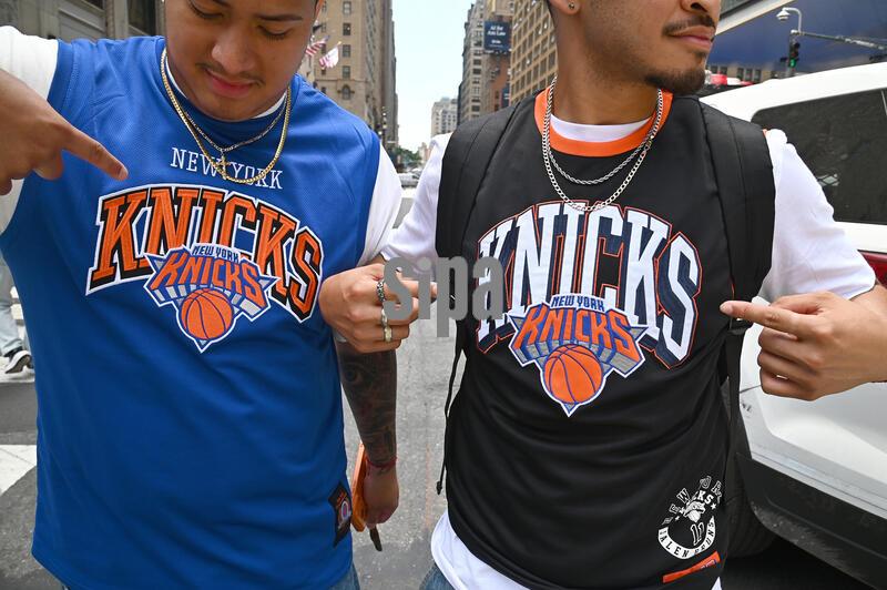 Two New York Knicks fans pose outside Madison Square Garden as the NYPD prepares to shut down streets ahead of President Trump's scheduled attendance at Game Three of the NBA Finals: New York Knicks vs. the San Antonio Spurs, New York, NY, June 8, 2026. (Photo by Anthony Behar/Sipa USA)