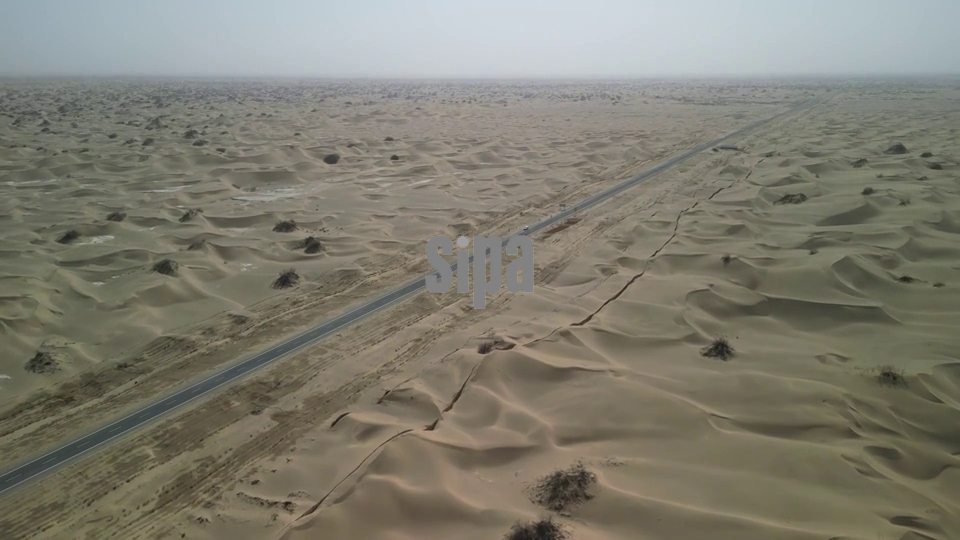 China: Green corridor shields desert highway in Xinjiang, China