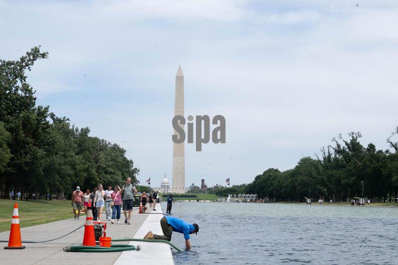 Algae is cleaned off of the floor of the Reflective Pool in Washington, DC, on Thursday, June 18, 2026. 
(Photo by Mattie Neretin/Sipa USA)