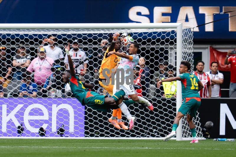 Senegal goalkeeper Mory Diaw #23 attempts to clear the ball while Belgium midfielder Youri Tielemans #8 heads, and scores a goal to tie the game 2-2 before the second half ends at the FIFA World Cup Round of 32 match between Belgium and Senegal in Seattle, Washington, on July 1, 2026. The winner advances to the Round of 16. (Photo by Sandra Agbotse/Sipa USA)