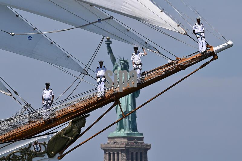 With the Statue of Liberty behind it, Portugal's NRP Sagres sails through New York Harbor as it takes part in the 'Sail4th250' Parade of Ships celebrating 250 anniversary of the United States on July 4, 2026.  The parade of ships included historic tall ships representing 40 nations celebrating America's Independence Day. (Photo by Anthony Behar/Sipa USA)