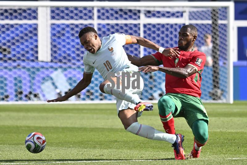 Morocco defender Issa Diop #14 fouls France forward Kylian Mbappe #10 and goes on to receive a yellow card warning for the play during the second half at the FIFA World Cup 2026 match at Boston Stadium, in Foxborough, Massachusetts on July 9, 2026.  (Photo by Eric Canha/Sipa USA)
