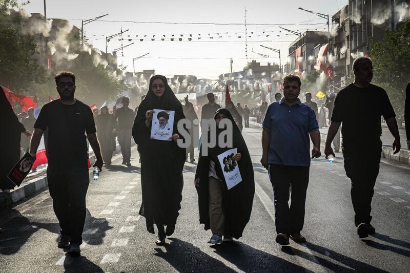 Funeral procession for Ali Khamenei moves through Tehran