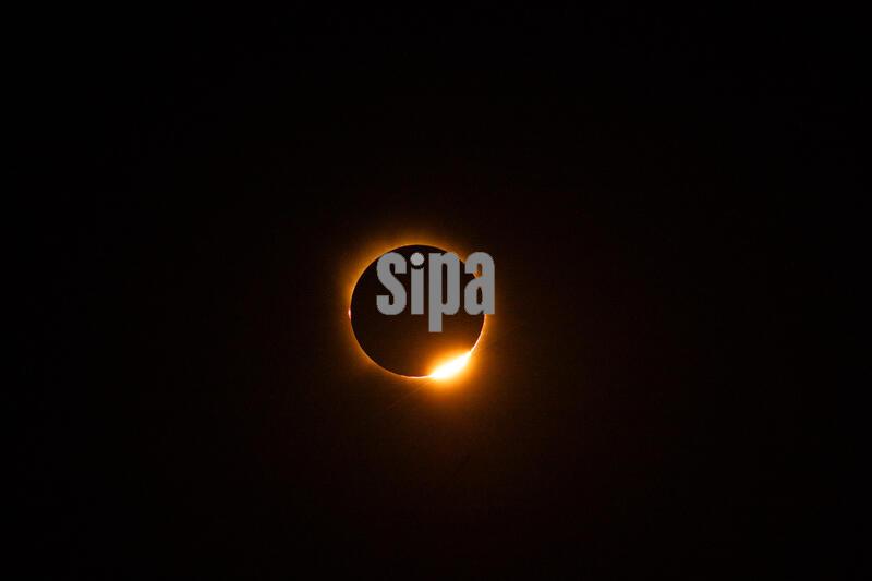 The corona of the Sun is visible around the Moon during totality of a solar eclipse in Alcocer, Guadalajara, Spain. The eclipse was the first total solar eclipse visible from mainland Spain in more than a century, with totality crossing the country from west to east near sunset. August 12, 2026 (ALTERPHOTOS/Sonia Villarroel)