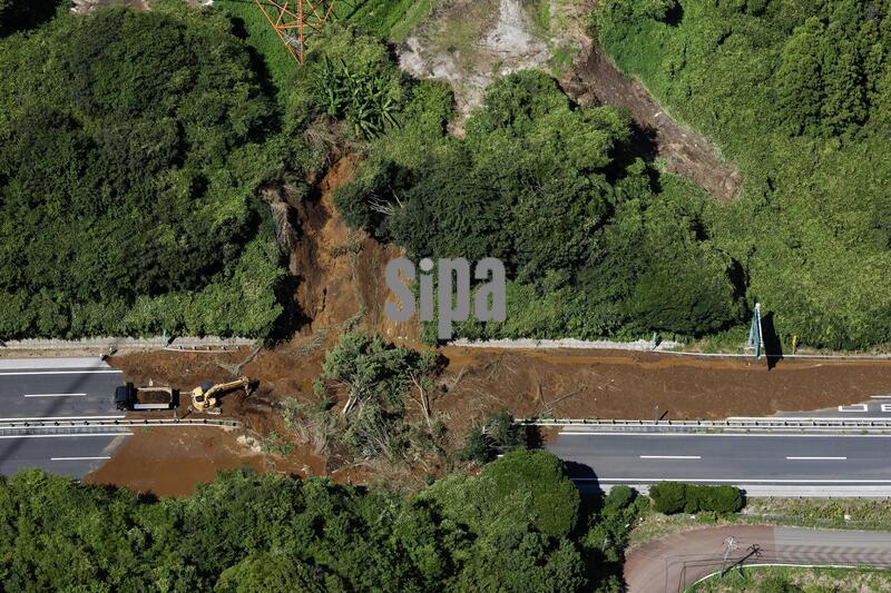 Photo taken from a Kyodo News helicopter shows the site of a mudslide in Togane in Chiba Prefecture, east of Tokyo, on Aug. 14, 2026, after torrential rain overnight. (Photo by Kyodo News/Sipa USA)
