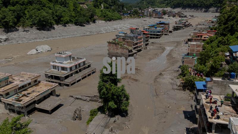 (260827) -- NUWAKOT, Aug. 27, 2026 (Xinhua) -- A drone photo taken on Aug. 27, 2026 shows a view of a massive flash flood-hit Nuwakot, Nepal. Nepal's National Disaster Risk Reduction Management Authority said that as many as 359 bodies had been recovered from flood-hit areas by Thursday evening, with 910 people still missing. (Photo by Sulav Shrestha/Xinhua) (Photo by Xinhua/Sipa USA)