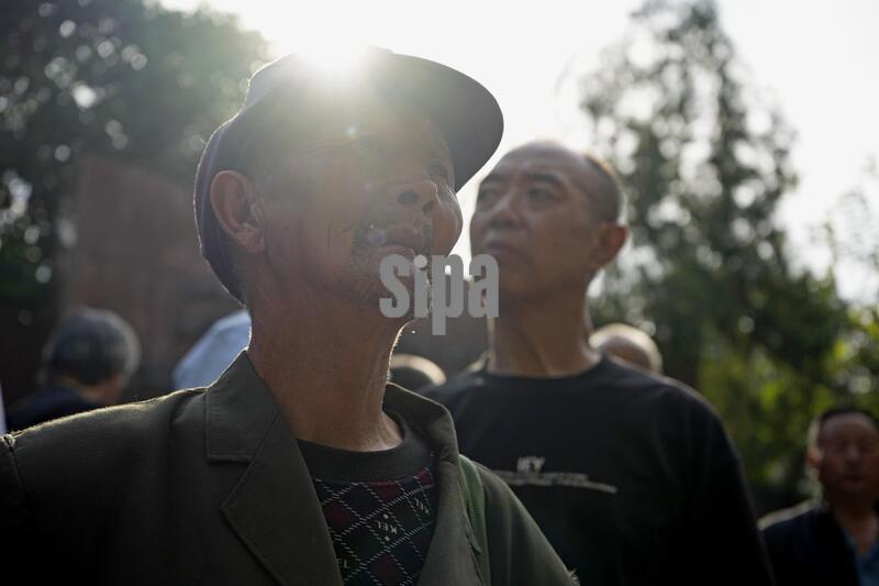 Family members of Chinese wartime forced laborers and others gather before filing a lawsuit against six Japanese companies with a court in Shijiazhuang, Hebei Province, southwest of Beijing, on Sept. 16, 2026. (Photo by Kyodo News/Sipa USA)
