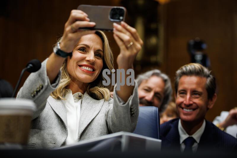 Nicole Saphier, President Trump’s nominee to be U.S. Surgeon General, takes a selfie with her husband, Paul Saphier, as she arrives to testify before the Senate Committee on Health, Education, Labor, and Pensions on September 16, 2026 in Washington, D.C. Saphier was nominated after the Trump administration was forced to withdraw Casey Means after her nomination stalled in the Senate due to opposition from both parties. (Photo by Samuel Corum/Sipa USA)