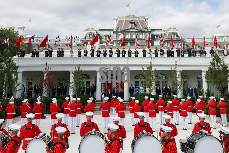 (From left to right) Chinese First Lady Peng Liyuan, Chinese President Xi Jinping, U.S. President Donald Trump, and U.S. First Lady Melania Trump participate in a military review in the Rose Garden at the White House on September 24, 2026 in Washington, D.C. Xi Jinping and Donald Trump are meeting to hash out a plethora of thorny issues from trade to Taiwan and AI: which both sides agree that neither can afford to tap the brakes on. (Photo by Samuel Corum/Sipa USA)