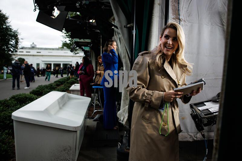 CNN senior reporter Betsy Klein finishes a live broadcast from CNN’s booth on the designated outdoor press area known as Pebble Beach on the North Lawn after being allowed back on to the grounds of the White House on September 24, 2026 in Washington, D.C. U.S. District Judge Timothy Kelly, who was appointed by Trump in 2017, ordered the White House to “immediately return, reinstate, and restore” the credentials held by employees of CNN, MS NOW and Politico after President Donald Trump banned the news organizations last week. (Photo by Samuel Corum/Sipa USA)