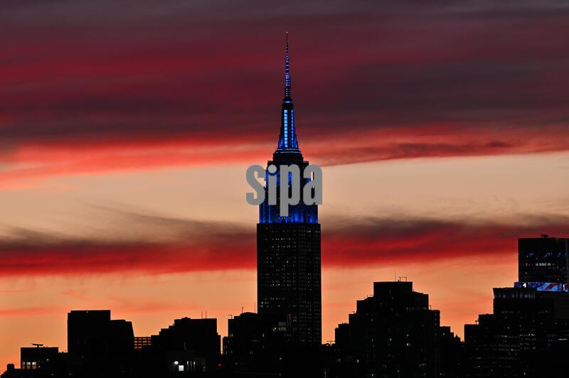 The Empire State Building is seen against autumn sunset-colored clouds as a nor’easter warning is issued for the upcoming weekend, seen from the New York City borough of Queens, NY, September 24, 2026.(Photo by Anthony Behar/Sipa USA)