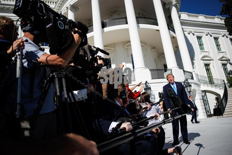 President Donald Trump speaks to reporters on the South Lawn before departing the White House in Marine One on October 5, 2026 in Washington, D.C. Trump is heading to Grand Island, Nebraska where he will speak at a rally for Republican Senator Pete Ricketts. (Photo by Samuel Corum/Sipa USA)