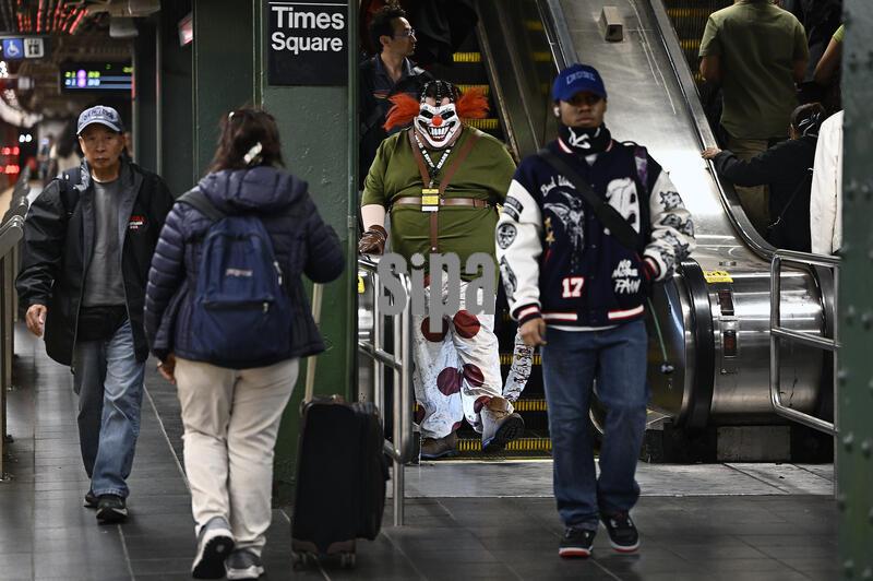 Jason Valentine, dresses as the video character 'Sweet Tooth' arrives on the No. 7 subway platform in Times Square en route to New York Comic Con 2026 at the Javits Center in New York, N.Y., October 8, 2026.(Photo by Anthony Behar/Sipa USA)
