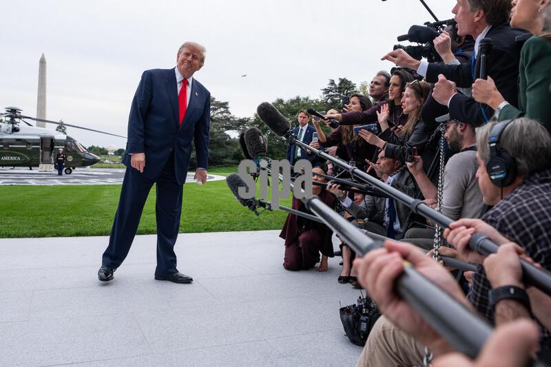 DC: US President Donald Trump speaks to members of the media on the South Lawn