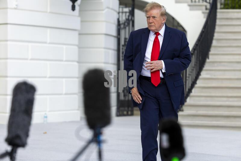 US President Donald J. Trump talks with reporters prior to his departure from the White House