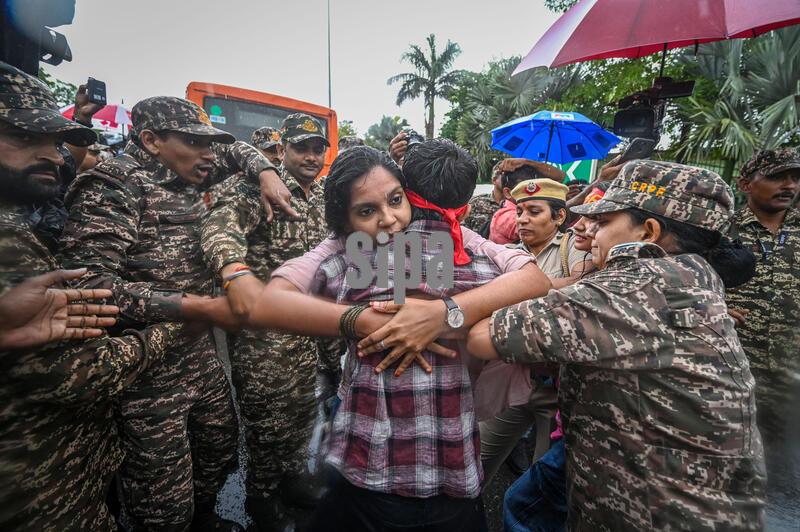 NEW DELHI, INDIA - OCTOBER 15: Police detain students and activists belonging to the All India Students' Federation (AISF) and All India Youth Federation (AIYF) during a 'Tiranga March' to protest the ongoing Special Intensive Revision (SIR) exercise and demand the immediate resignation of Chief Election Commissioner (CEC) Gyanesh Kumar at the Inner Circle of Connaught Place on October 15, 2026 in New Delhi, India. (Photo by Sanchit Khanna/Hindustan Times/Sipa USA)