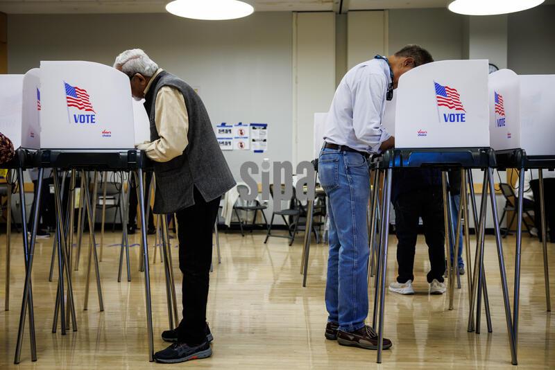 Voters fill in their ballot at the polling location in the Wheaton Library and Community Recreation Center on October 22, 2026 in Wheaton, Maryland. Today was the first day that Maryland voters could cast their ballots in the November midterm elections which is less than two weeks away. (Photo by Samuel Corum/Sipa USA)