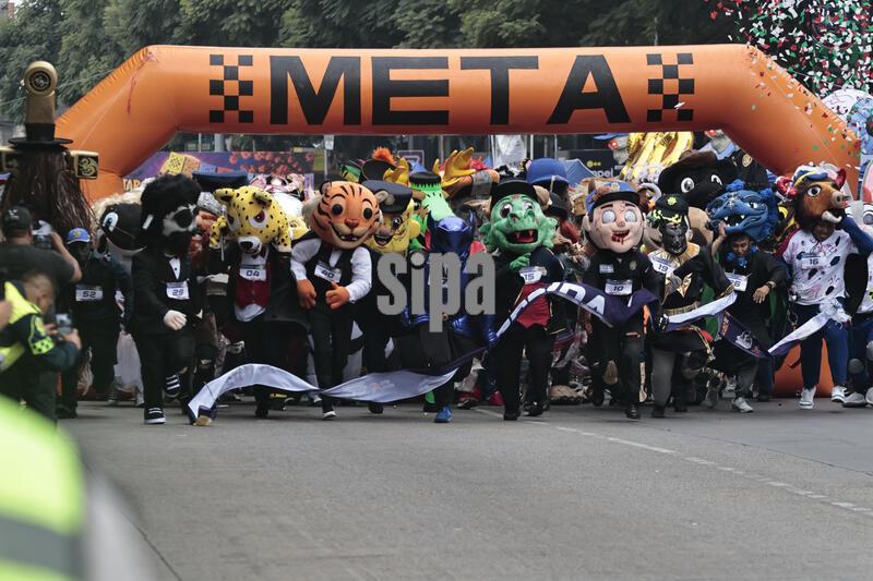 Competitors in the second edition of the mascot race wait to start from the starting line on October 24, 2026, in Mexico City, Mexico. The Mexico City Secretariat of Citizen Security held its second annual Mascot Race, which took place as part of the Day of the Dead festivities. The 52 competitors wore oversized costumes to race along one of the city’s main avenues, delighting the attendees who enjoyed watching these mascots dash toward victory. (Photo by Josue Pérez/Nexpher Images/Sipa USA)