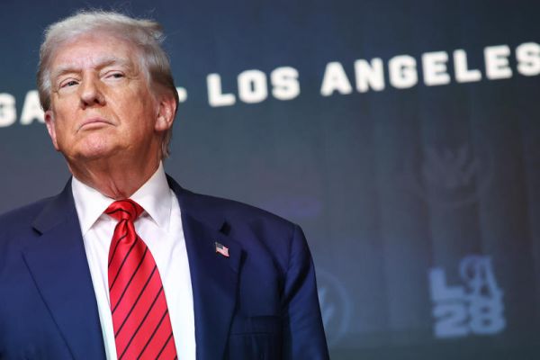 U.S. President Donald Trump listens during an event where he will be signing an executive order establishing a task force to oversee the Los Angeles 2028 Olympic Games in the South Court Auditorium at the White House on August 5, 2025 in Washington, D.C. The task force will assist in coordination between officials with the city of Los Angeles, LA28, and the federal government as they prepare for the 2028 Olympic Games. (Photo by Samuel Corum/Sipa USA)