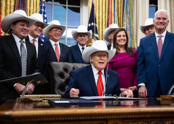 President Donald Trump takes part in a bill signing to award Congressional Gold Medals to the 1980 U.S. Olympic ice hockey team in the Oval Office at the White House Dec. 12, 2025.