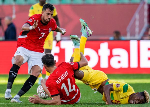 Francisco Doku of Benin fights for the ball with Hamdy Fathy of Egypt and Mahmoud Trezeguet of Egypt during the Africa Cup of Nations (CAN) 2025 Round of 16 football match between Egypt and Benin at Agadir Stadium in Agadir, Morocco, on January 5, 2026.